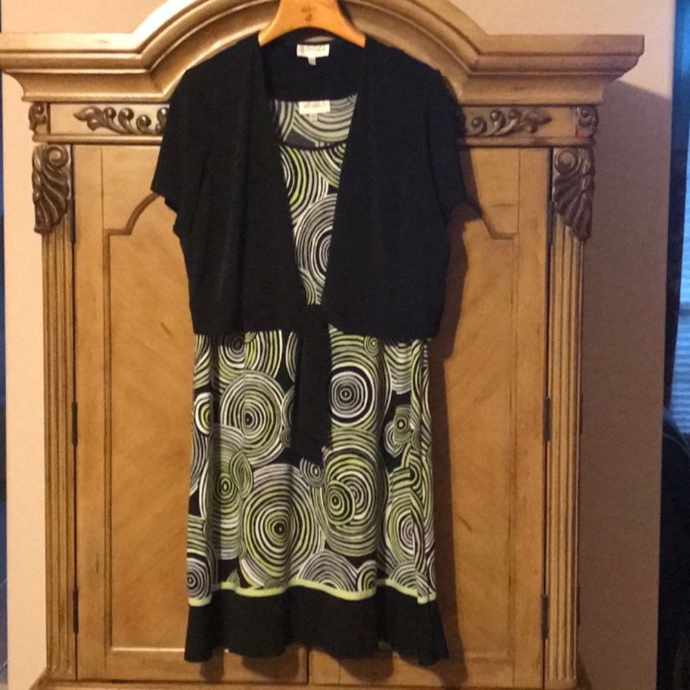 Woman’s Plus size dress with black crop jacket.